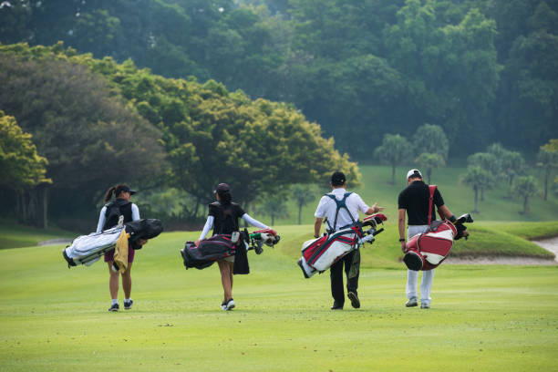 Golfers walking to the next hole